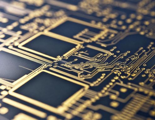In-Mold Electronics IME showing printed conductive circuits on 3D-formed film embedded in injection molded plastic componen