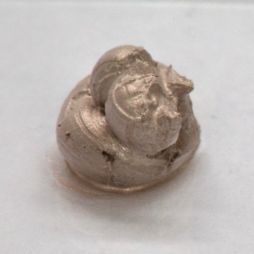 Silver reddish paste blob of a low-temperature paste on a glass plate